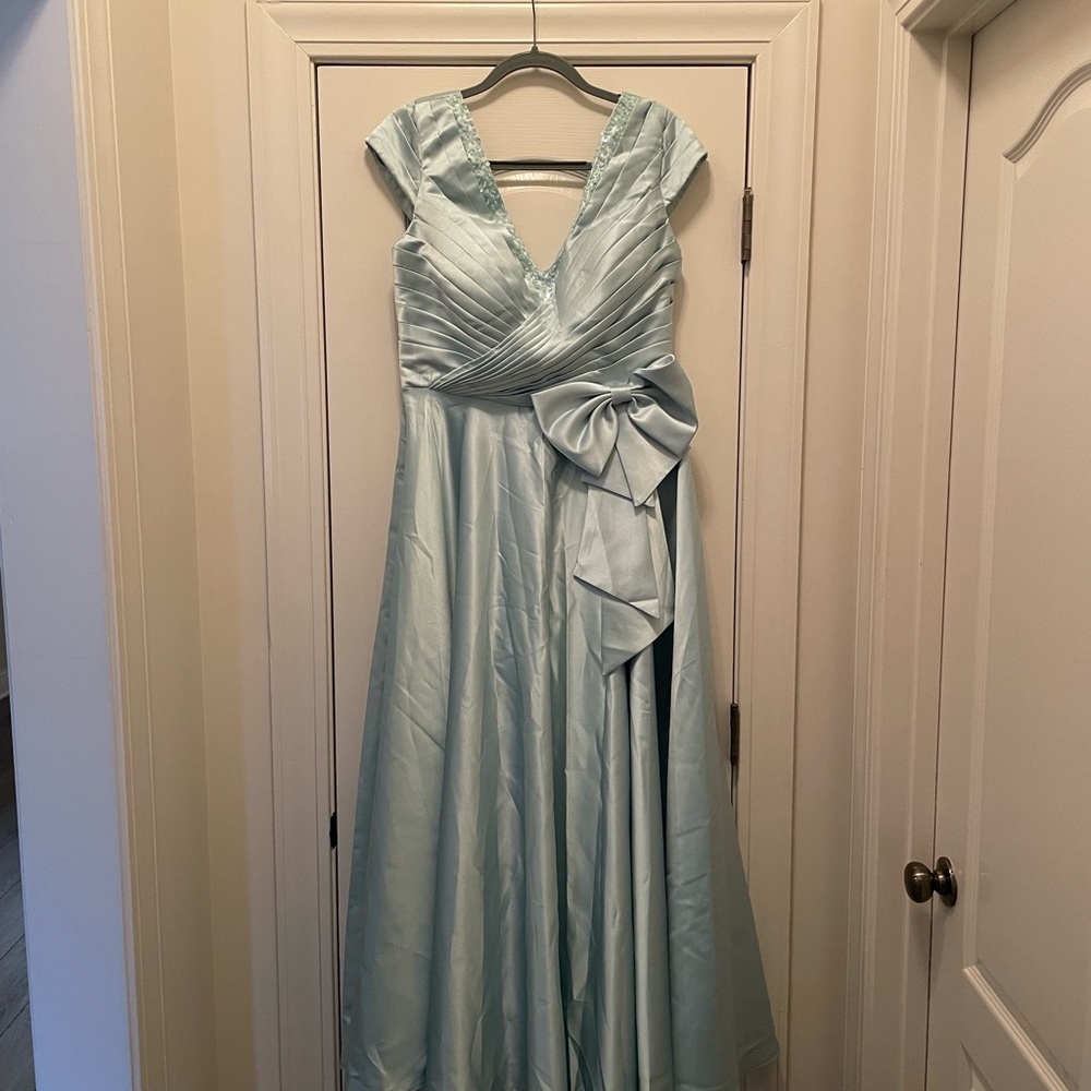 Full length Mother of the Bride/Groom mint green dress.